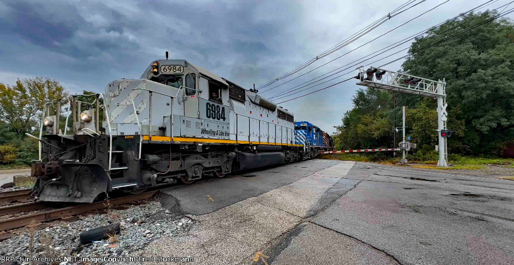 WE 6984 has crossed to 2 track and heads to National Lime & Stone Co.